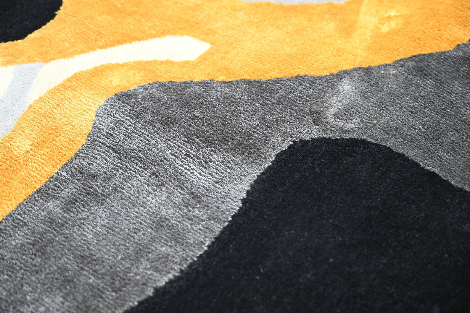 A close shot of Molten Flow Rug which show the color and detail